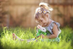 A little girl playing with a bunny in Just Children Center in PA