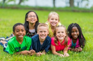 The group of children' s laying in the grass at Laurel, NJ 