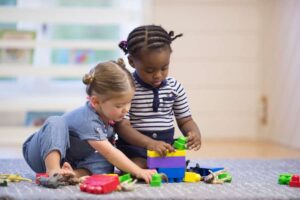 Two kids playing together in preschool in Laurel, NJ