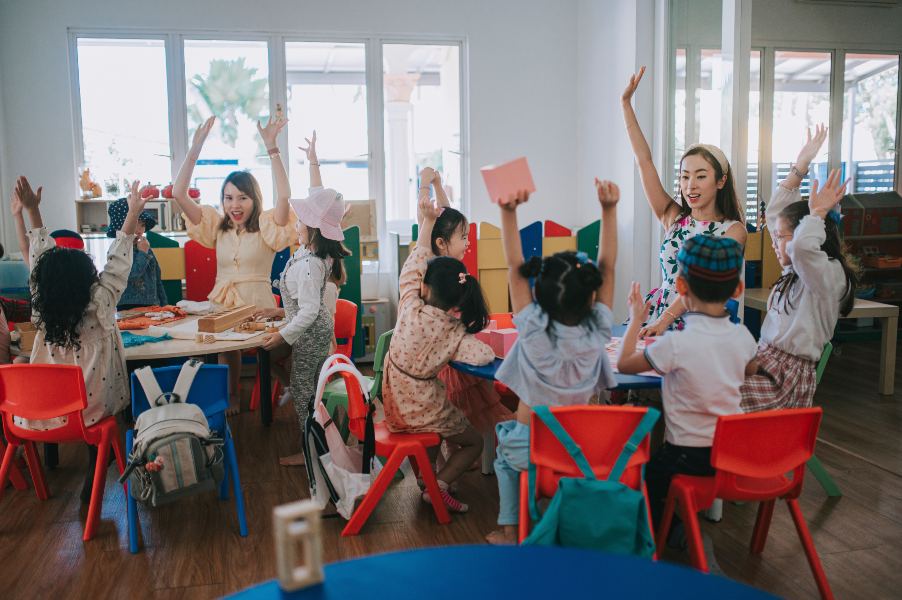 kids raising their hands