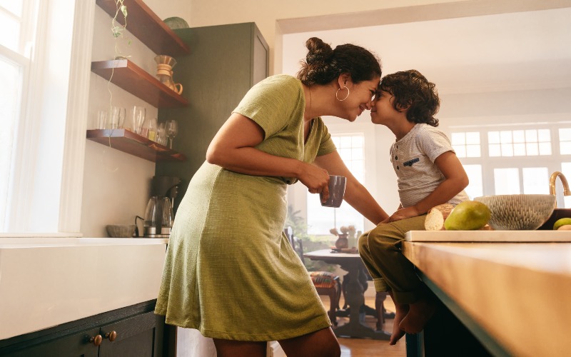 Parent and child share a warm moment while learning parenting styles at home in Bensalem, PA.